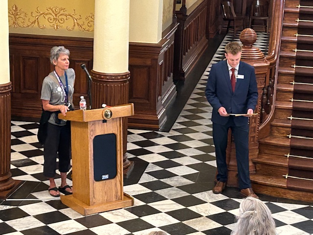 woman speaking at podium